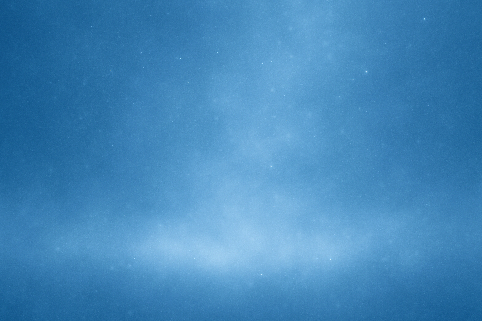 淡い青のグラデーションに、細かな粒子が静かに漂う抽象背景。中央に広い余白がある落ち着いたデザイン